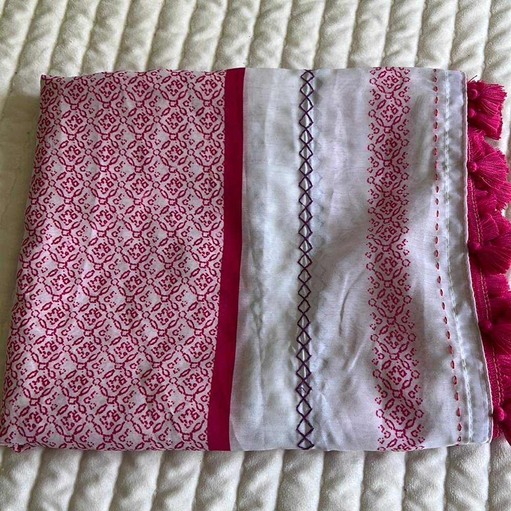 Tasseled sheer pink and white curtain panel